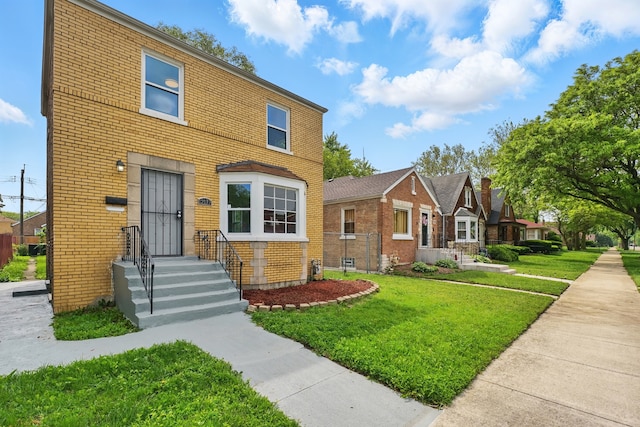 12137 S Perry Ave, Chicago, IL 60628 - view of front of home with brick siding and a front yard