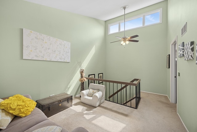 2618 Smith St, Rolling Meadows, IL 60008 - sitting room featuring an upstairs landing, carpet floors, ceiling fan, baseboards, and a towering ceiling