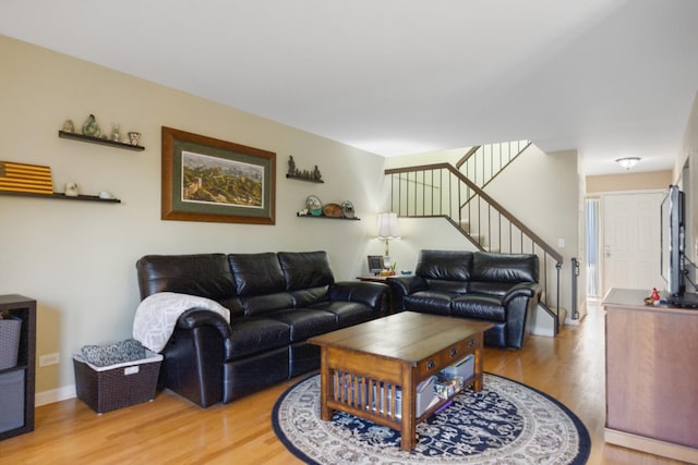 2618 Smith St, Rolling Meadows, IL 60008 - living area featuring light wood-style floors, stairs, and baseboards