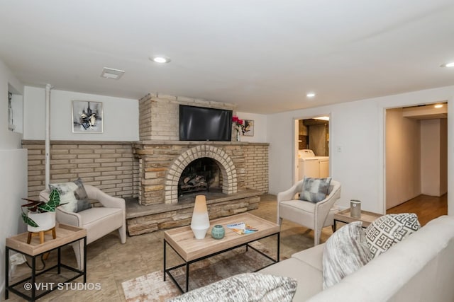 7912 W Lawrence Ave Unit C, Norridge, IL 60706 - living area featuring a fireplace, washing machine and dryer, and recessed lighting
