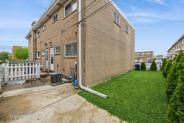 7912 W Lawrence Ave Unit C, Norridge, IL 60706 - view of home's exterior featuring central AC unit and brick siding