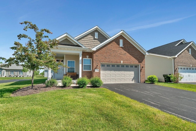 25626 S Geraldine Ct, Channahon, IL 60410 - view of front of property with a garage, brick siding, a front yard, and driveway
