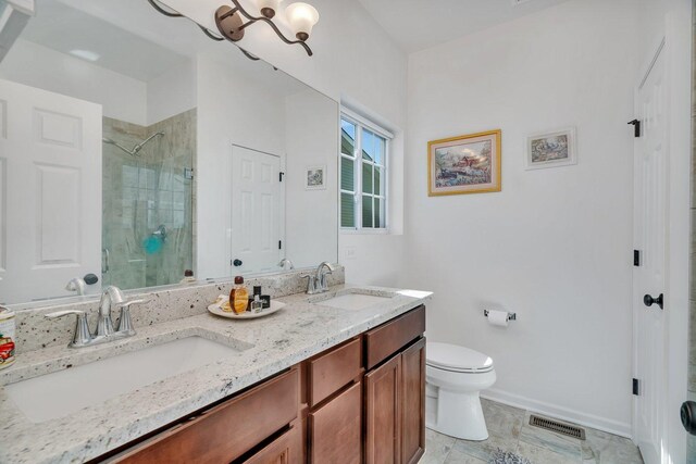 25626 S Geraldine Ct, Channahon, IL 60410 - full bath with a stall shower, toilet, double vanity, and baseboards