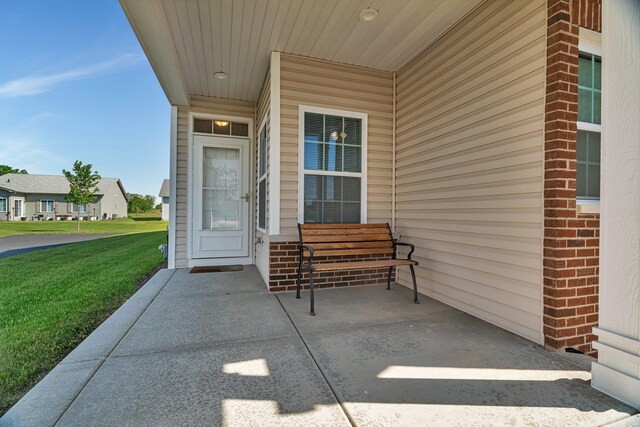 25626 S Geraldine Ct, Channahon, IL 60410 - view of exterior entry with a lawn and brick siding