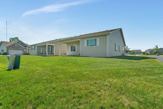 25626 S Geraldine Ct, Channahon, IL 60410 - rear view of house with a lawn