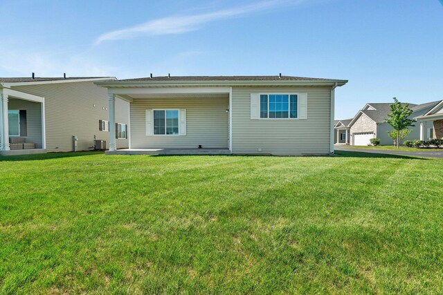 25626 S Geraldine Ct, Channahon, IL 60410 - back of house with central AC and a yard