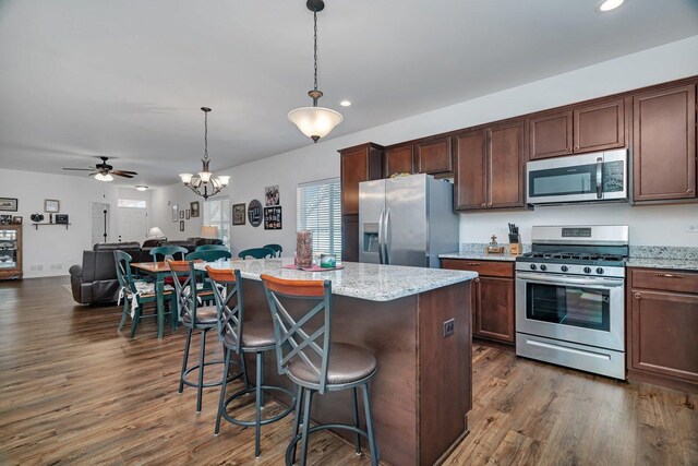 25626 S Geraldine Ct, Channahon, IL 60410 - kitchen featuring appliances with stainless steel finishes, open floor plan, a ceiling fan, recessed lighting, and dark wood-style flooring