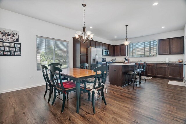 25626 S Geraldine Ct, Channahon, IL 60410 - dining room featuring recessed lighting, dark wood finished floors, a chandelier, and baseboards