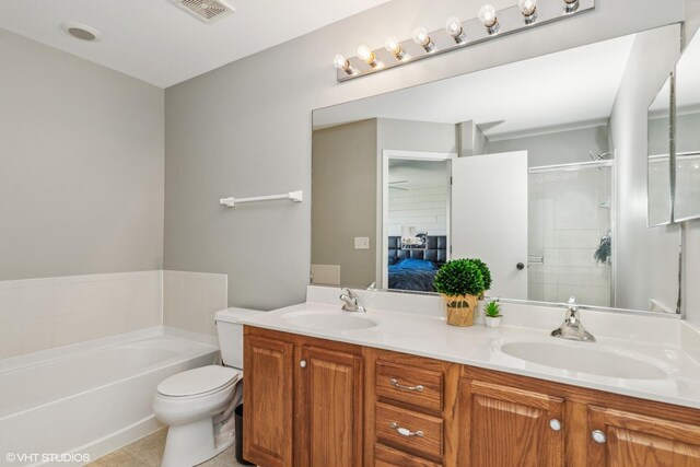 39642 N Warren Ln Unit 0, Beach Park, IL 60083 - ensuite bathroom with double vanity, a stall shower, a garden tub, tile patterned floors, and toilet