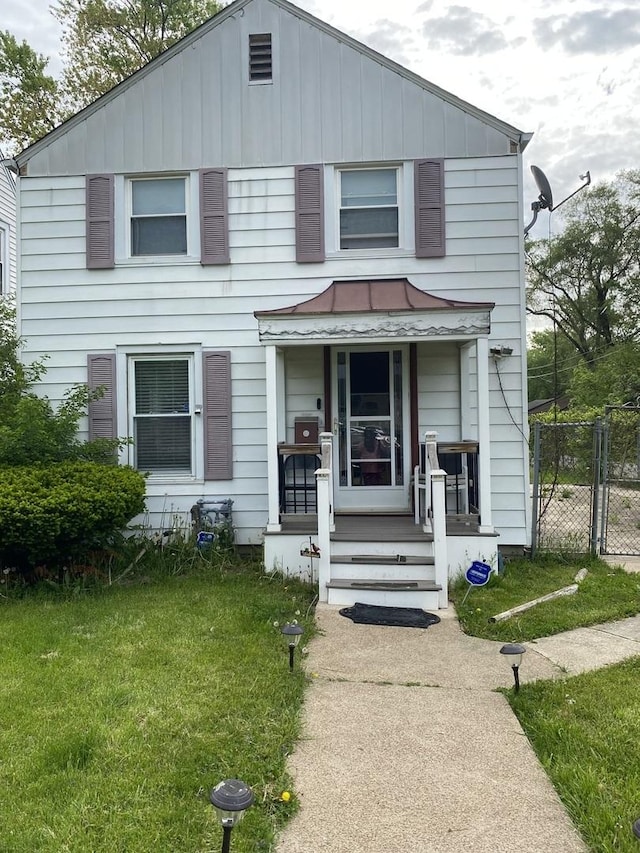 14735 Myrtle Ave, Harvey, IL 60426 - view of front facade featuring a gate and board and batten siding