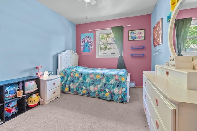 bedroom featuring multiple windows, light carpet, and ceiling fan