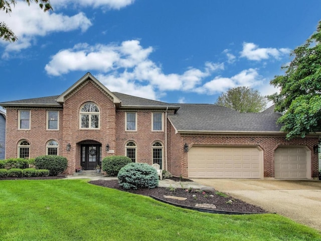 1664 Imperial Cir, Naperville, IL 60563 - colonial-style house with brick siding, a front yard, a garage, concrete driveway, and a shingled roof