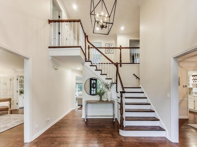 1664 Imperial Cir, Naperville, IL 60563 - stairway featuring a high ceiling, crown molding, a chandelier, wood finished floors, and baseboards