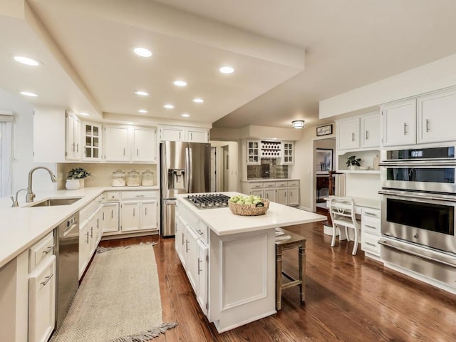 1664 Imperial Cir, Naperville, IL 60563 - kitchen with appliances with stainless steel finishes, a sink, a warming drawer, light countertops, and recessed lighting