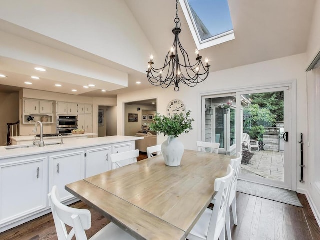 1664 Imperial Cir, Naperville, IL 60563 - dining space with a chandelier, dark wood-style floors, recessed lighting, high vaulted ceiling, and a skylight