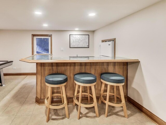 1664 Imperial Cir, Naperville, IL 60563 - indoor bar with freestanding refrigerator, baseboards, recessed lighting, and light tile patterned floors