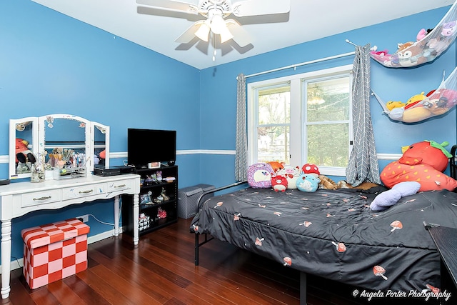 bedroom with wood-type flooring and ceiling fan
