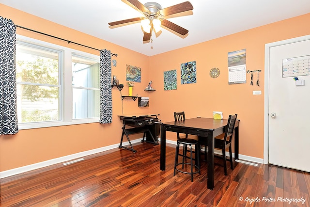 dining area with dark wood finished floors, ceiling fan, and baseboards