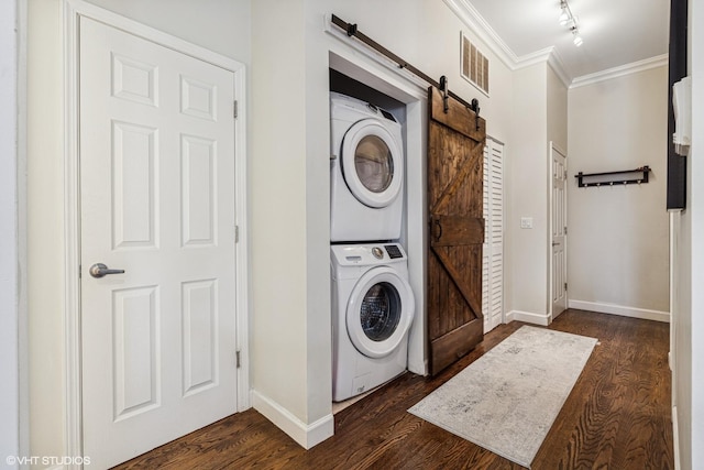 1460 W Ohio St Unit 3R, Chicago, IL 60642 - laundry area with estacked washer and dryer, a barn door, ornamental molding, baseboards, and dark wood finished floors