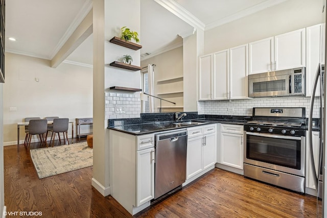 1460 W Ohio St Unit 3R, Chicago, IL 60642 - kitchen with stainless steel appliances, a sink, ornamental molding, white cabinets, and tasteful backsplash