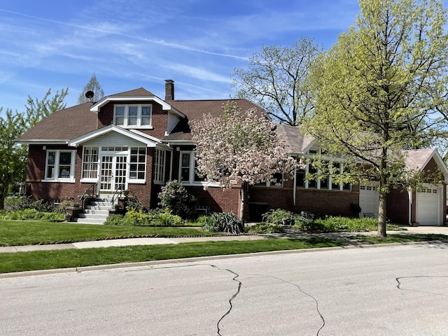 9600 W Shore Dr, Oak Lawn, IL 60453 - view of front of house featuring brick siding, a chimney, french doors, and a front yard
