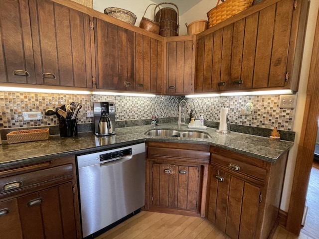 9600 W Shore Dr, Oak Lawn, IL 60453 - kitchen with a sink, dishwasher, light wood-style floors, backsplash, and dark stone countertops