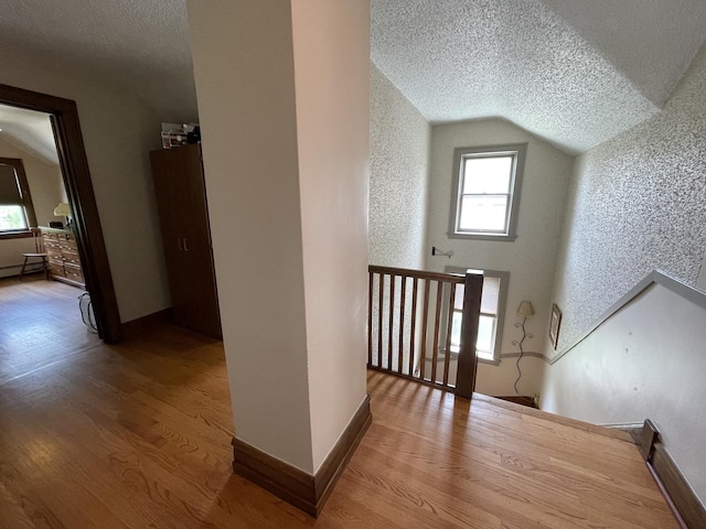 9600 W Shore Dr, Oak Lawn, IL 60453 - hall with a textured ceiling, wood finished floors, lofted ceiling, and baseboards