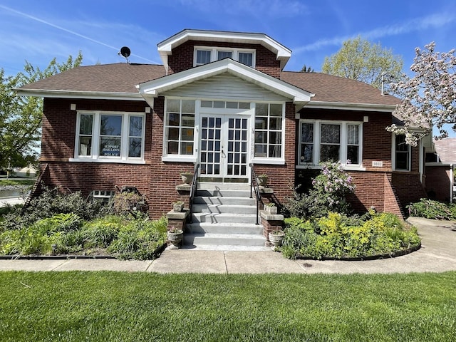 9600 W Shore Dr, Oak Lawn, IL 60453 - bungalow with brick siding, french doors, roof with shingles, and a front lawn