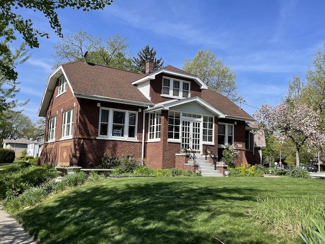 9600 W Shore Dr, Oak Lawn, IL 60453 - view of front of property featuring brick siding, a front yard, roof with shingles, and a chimney