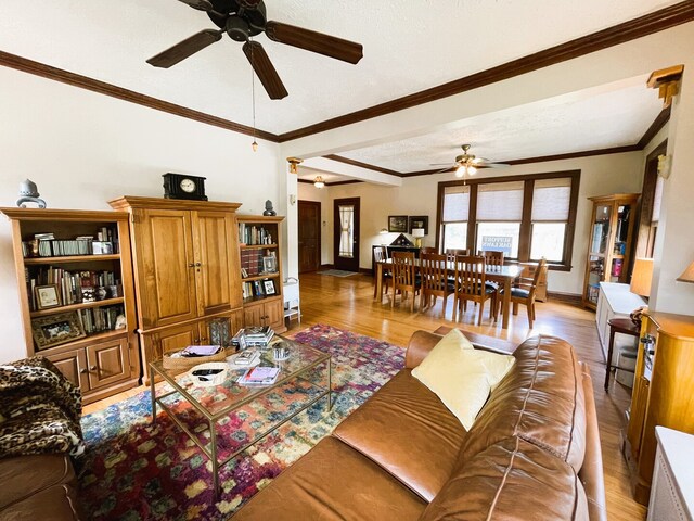 9600 W Shore Dr, Oak Lawn, IL 60453 - living area with a ceiling fan, light wood finished floors, baseboards, and crown molding