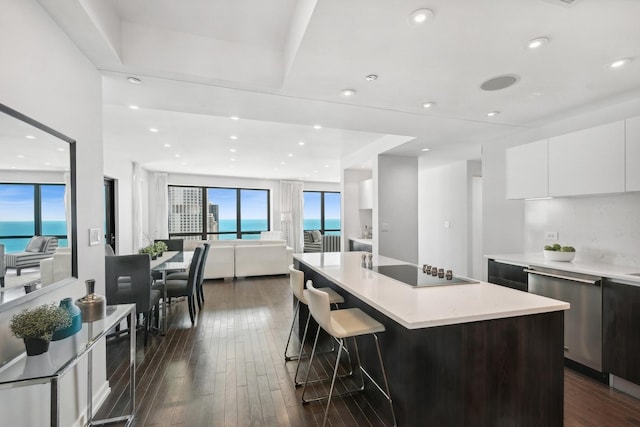 130 N Garland Ct Unit 3803, Chicago, IL 60602 - kitchen with modern cabinets, stainless steel dishwasher, black electric cooktop, white cabinets, and light countertops