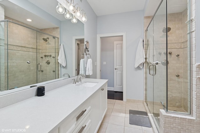 3447 N Whipple St, Chicago, IL 60618 - full bathroom with tile patterned floors, a shower stall, and vanity