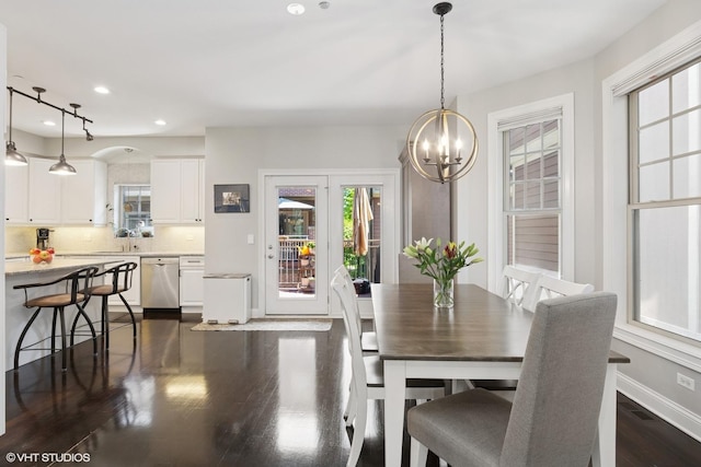 3447 N Whipple St, Chicago, IL 60618 - dining space featuring a chandelier, dark wood-style flooring, recessed lighting, and baseboards