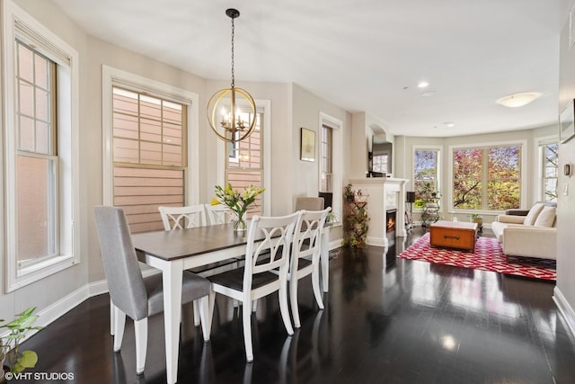 3447 N Whipple St, Chicago, IL 60618 - dining area featuring baseboards, healthy amount of natural light, a chandelier, dark wood finished floors, and recessed lighting