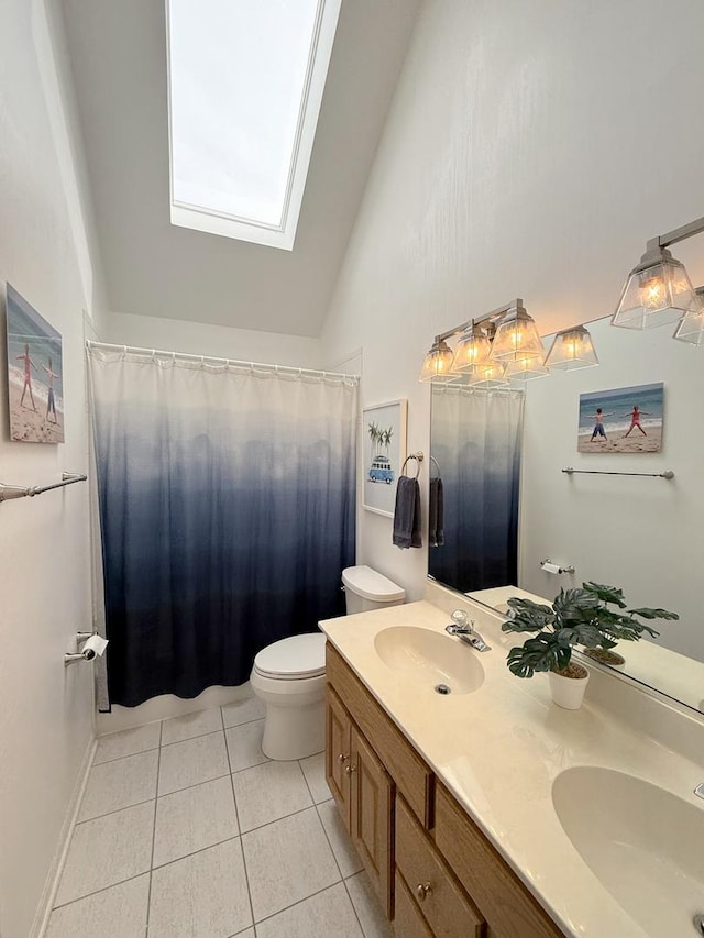 40W095 Carl Sandburg Rd, Saint Charles, IL 60175 - full bath featuring a skylight, tile patterned floors, toilet, double vanity, and high vaulted ceiling