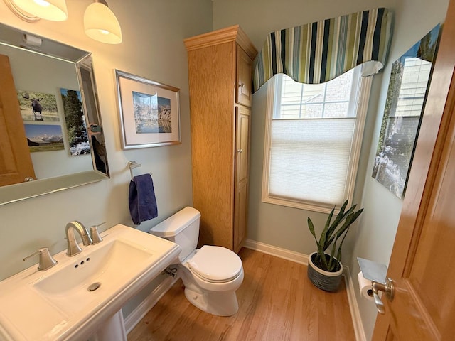 40W095 Carl Sandburg Rd, Saint Charles, IL 60175 - bathroom featuring wood finished floors, toilet, baseboards, and a sink