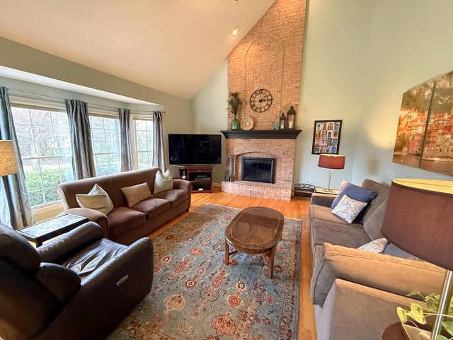 40W095 Carl Sandburg Rd, Saint Charles, IL 60175 - living room featuring high vaulted ceiling, wood finished floors, and a brick fireplace