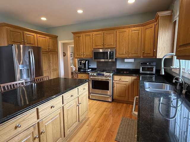 40W095 Carl Sandburg Rd, Saint Charles, IL 60175 - kitchen featuring stainless steel appliances, a sink, light wood-style flooring, recessed lighting, and dark stone counters