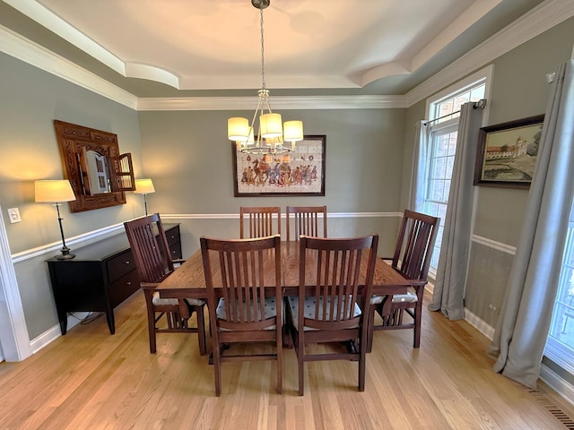 40W095 Carl Sandburg Rd, Saint Charles, IL 60175 - dining room featuring a chandelier, light wood-style flooring, a tray ceiling, baseboards, and ornamental molding