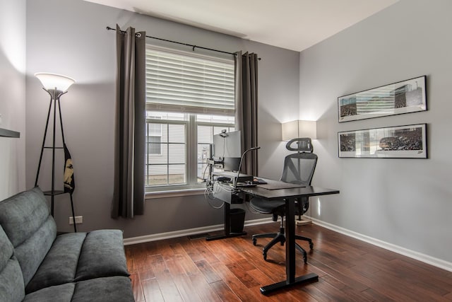 home office featuring hardwood / wood-style floors and baseboards