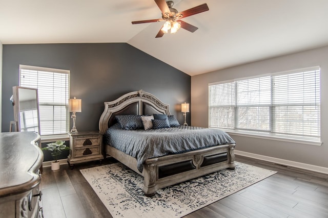 bedroom with lofted ceiling, baseboards, dark wood-style flooring, and ceiling fan