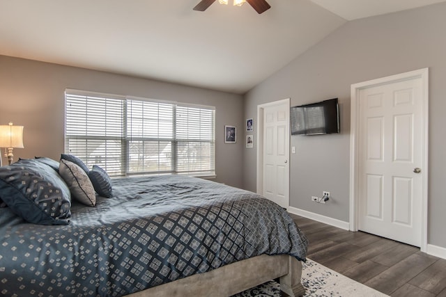 bedroom featuring vaulted ceiling, wood finished floors, baseboards, and ceiling fan