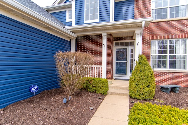 entrance to property with brick siding