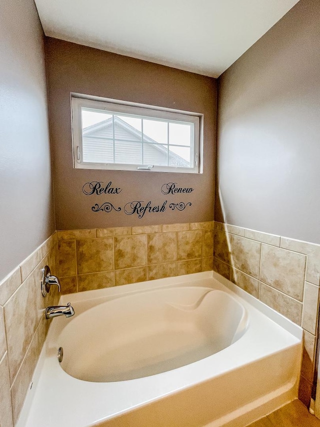 full bathroom featuring a garden tub