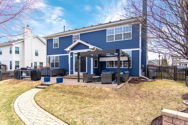 rear view of house with a hot tub, an outdoor hangout area, and a patio