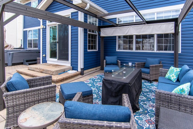 view of patio / terrace featuring a hot tub and outdoor lounge area
