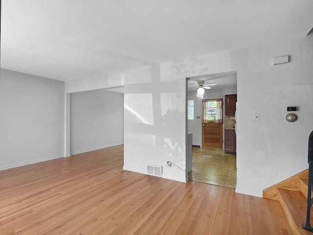 1048 Marshall Dr, Des Plaines, IL 60016 - unfurnished room featuring light wood finished floors, ceiling fan, and baseboards