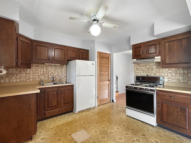 1048 Marshall Dr, Des Plaines, IL 60016 - kitchen featuring white appliances, a sink, ceiling fan, under cabinet range hood, and light countertops