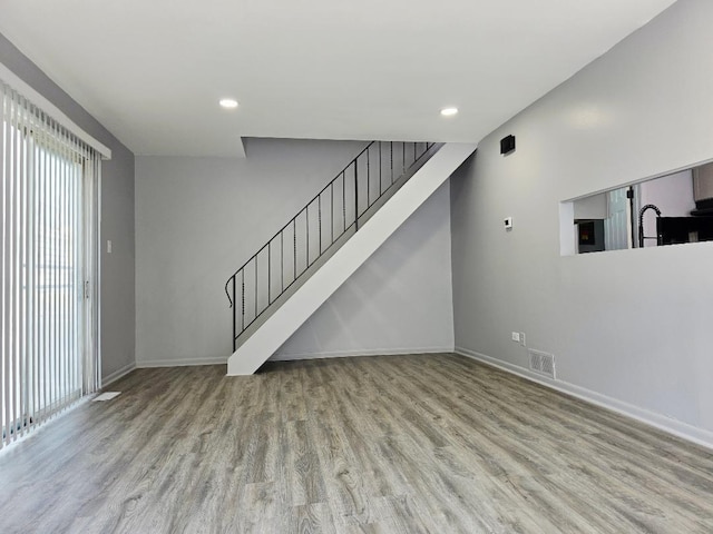 20120 Ash Ln Unit 0, Lynwood, IL 60411 - unfurnished living room with wood finished floors, baseboards, recessed lighting, and stairs