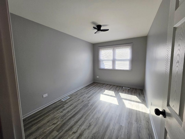 20120 Ash Ln Unit 0, Lynwood, IL 60411 - spare room featuring dark wood finished floors, a ceiling fan, and baseboards